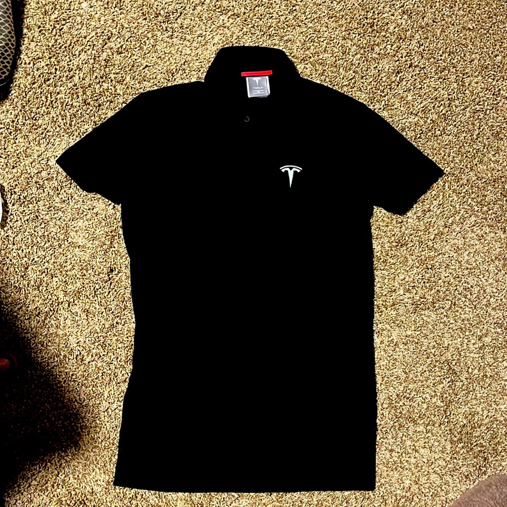 All black women’s Tesla embroidered polo.